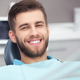 A happy dental patient in a dentist’s chair