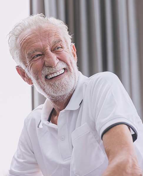 a dental implant patient smiling