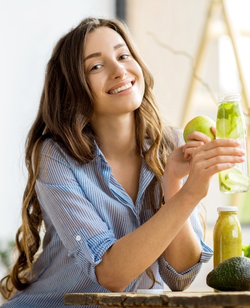 Woman eating and drinking healthy to maintain whole health