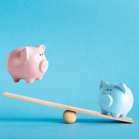 Piggy banks on a balance scale