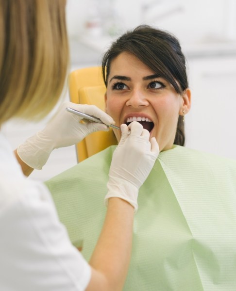 Woman receiving dental treatment