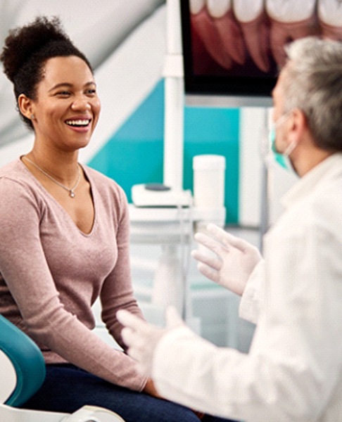 woman talking with dentist in Glendale