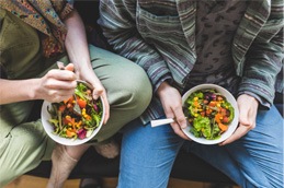 Couple eating colorful salad