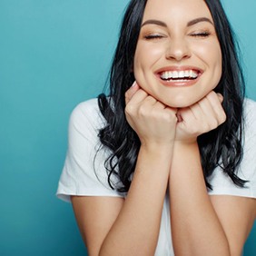 Smiling lady shows off clear aligners Lady smiles