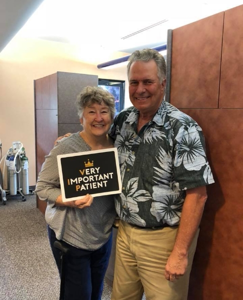 Doctor Upton smiling with dental patient