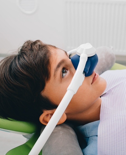 Child with nitrous oxide dental sedation mask