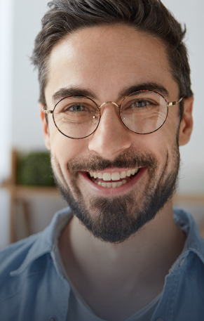 Man with straighter smile after Invisalign clear braces treatment