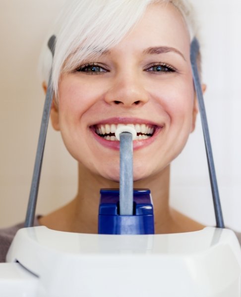 Woman receiving C T cone beam scanner