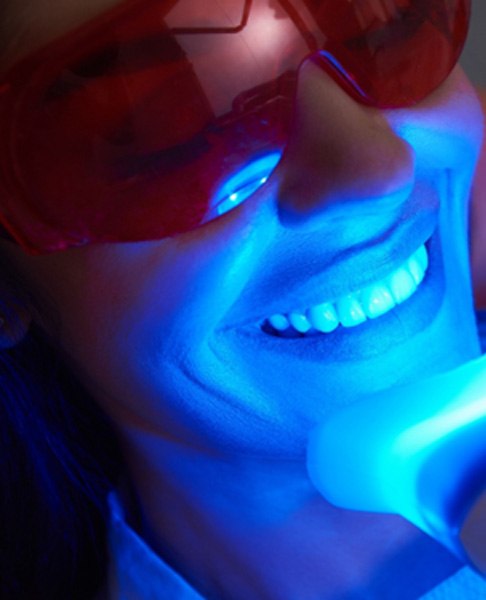 A woman receiving a teeth whitening treatment