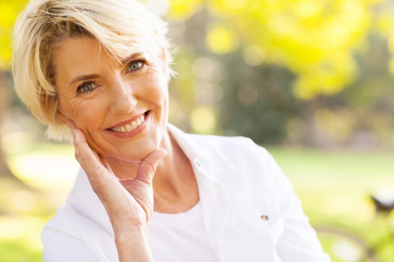 woman smiling with dental implants in Glendale